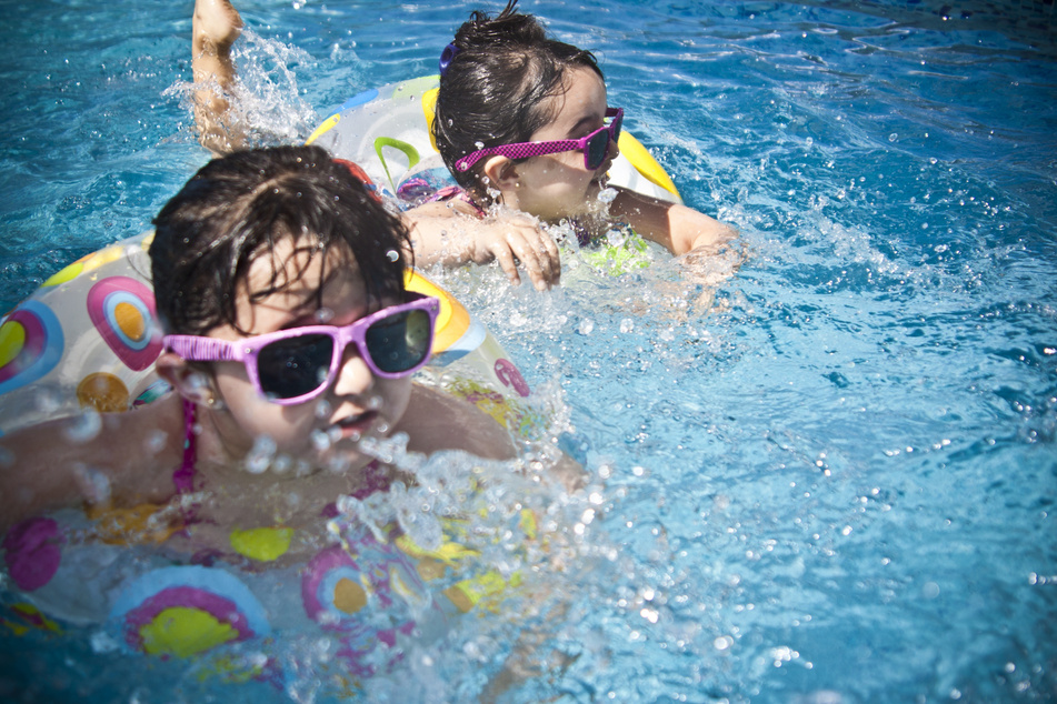 Cute Kids Swimming in the Pool